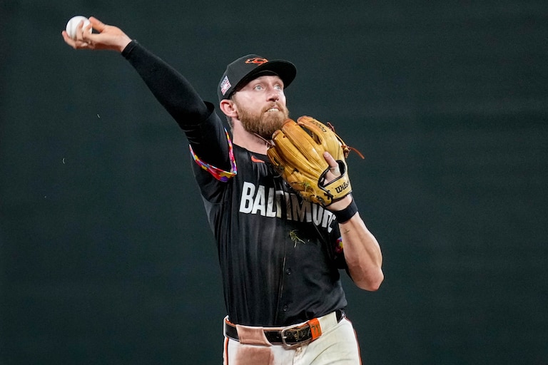 Baltimore Orioles third baseman Jordan Westburg (11) throws to a fan in the crowd in the 9th inning of a game against the Colorado Rockies at Oriole Park at Camden Yards in Baltimore, Md. on Friday, July 25, 2025.