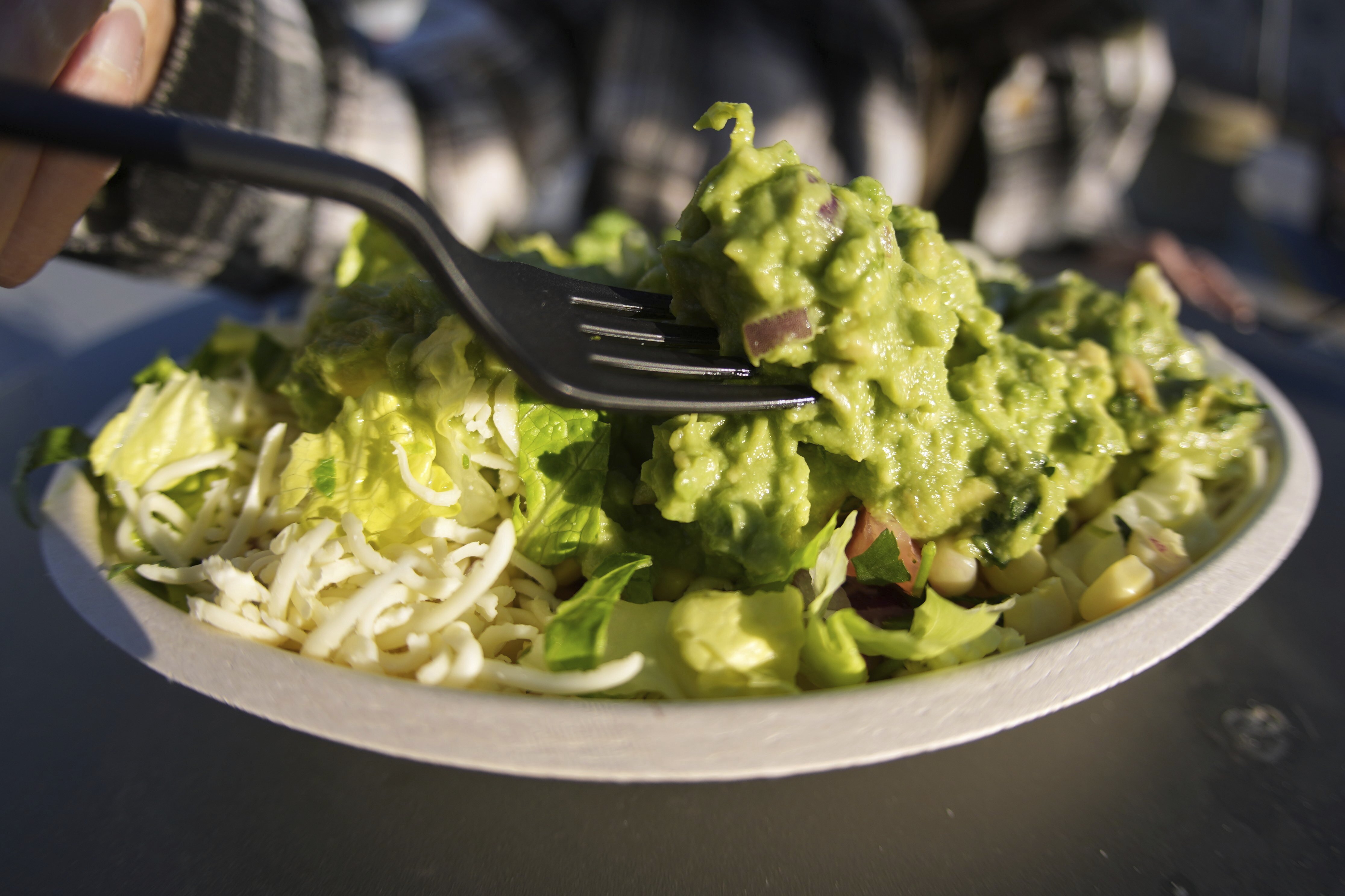Avocados from Mexico top a bowl for a customer at a Chipotle restaurant in Pittsburgh, Tuesday, March 4, 2025.