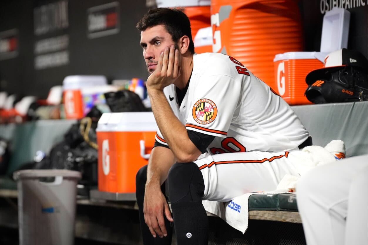 Baltimore Orioles starting pitcher Grayson Rodriguez (30) watches the game from the dugout after his night ended in the fifth inning on Tuesday, April 11. This game against the Oakland Athletics was Rodriguez's first career start at Camden Yards.