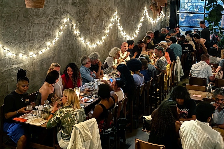 Clavel Owner Lane Harlan and her staff moved plants and tables to make sure musician David Byrne's large crew were comfortable in the restaurant's dining area.