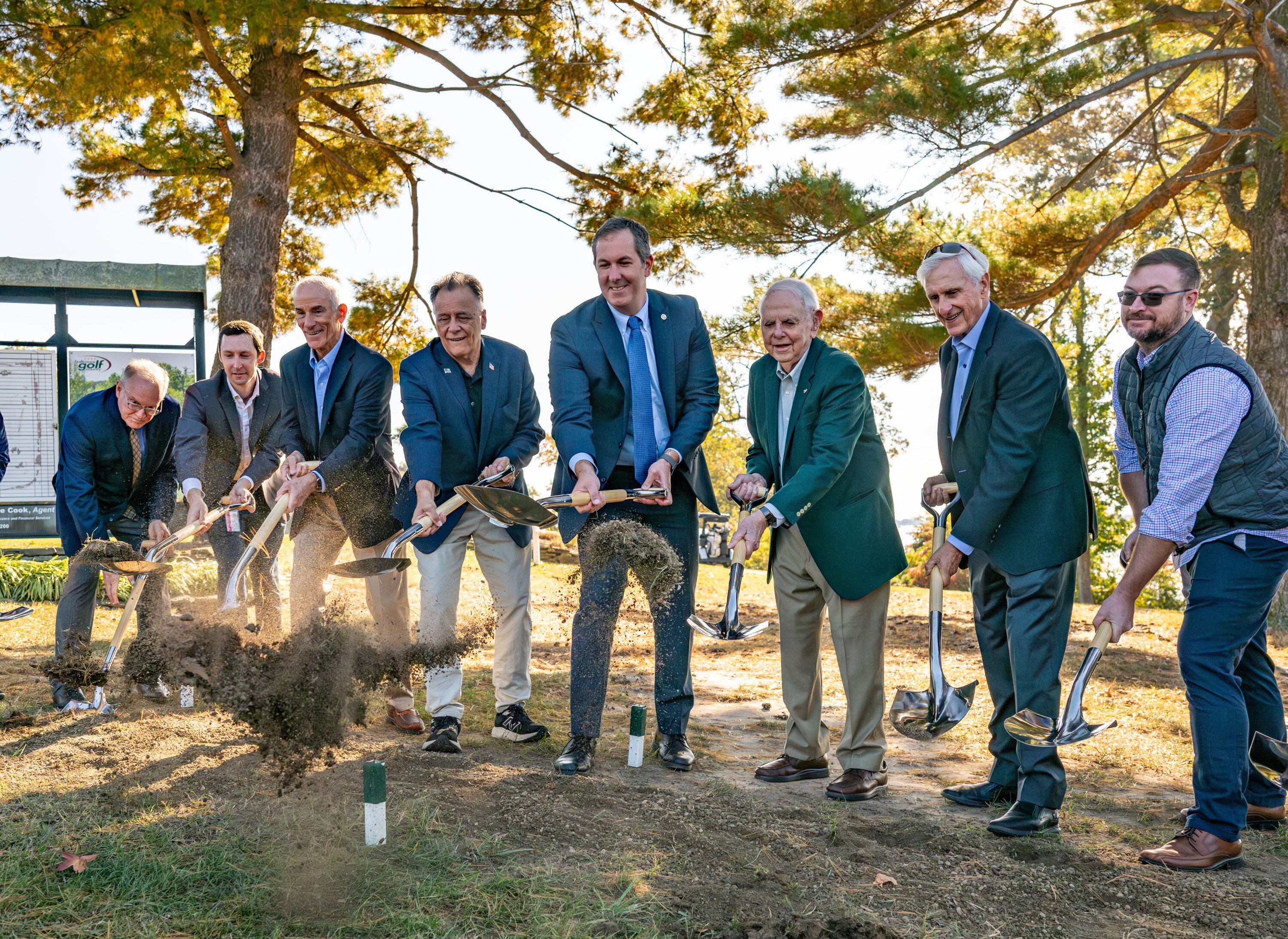 Baltimore County Executive Johnny Olszewski, center, participates in the groundbreaking for a new clubhouse at the county-owned Rocky Point Golf Course.