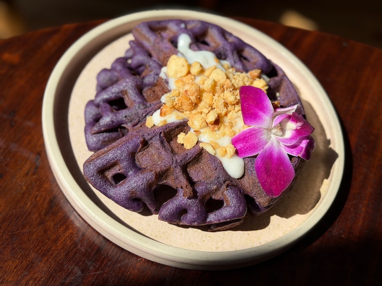 The Duchess in Hampden serves an ube mochi waffle topped with haupia and macadamia nuts.