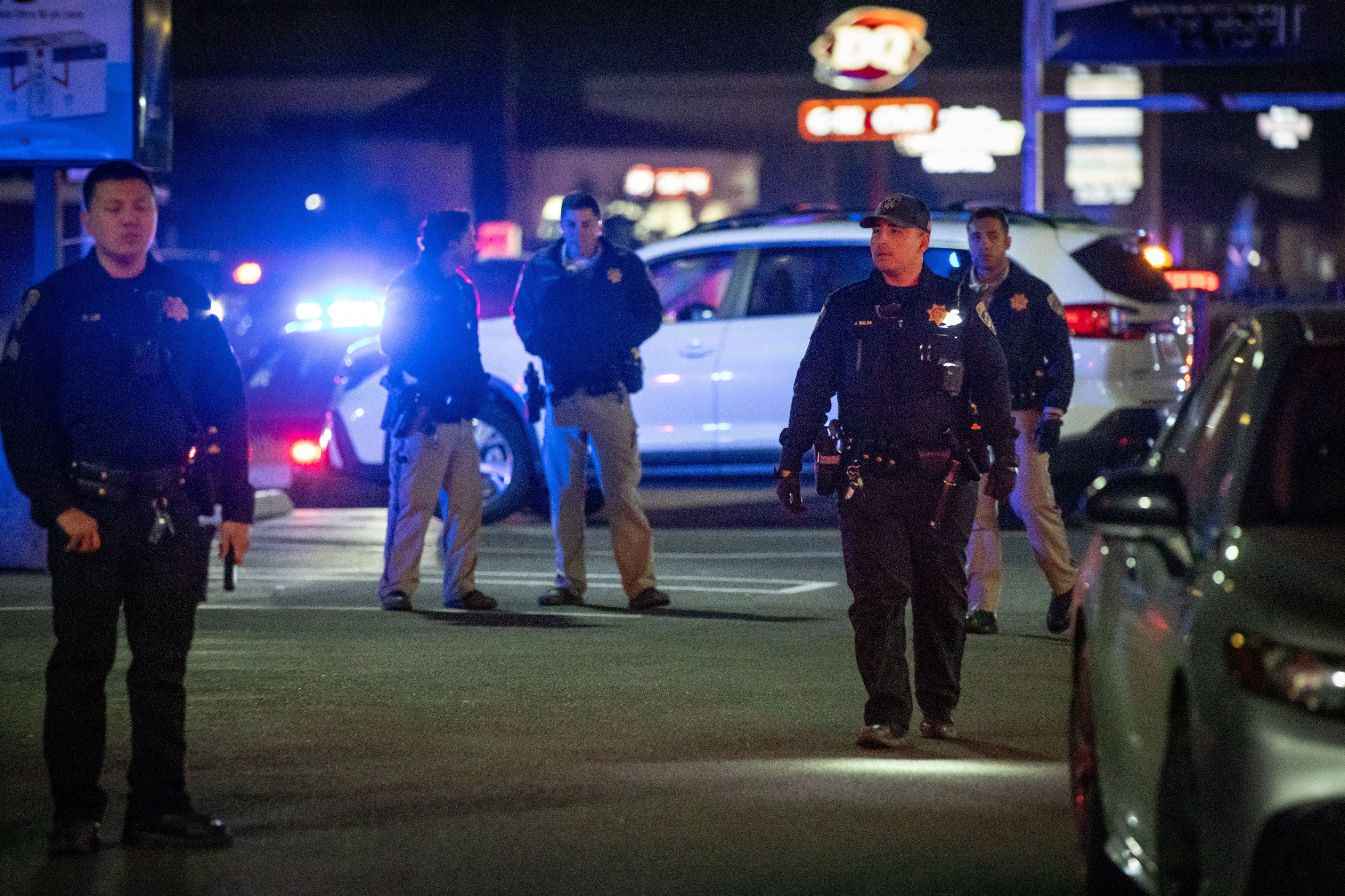 First responders walk through a parking lot near the scene of a mass shooting Saturday, Nov. 29, 2025, in Stockton, Calif.