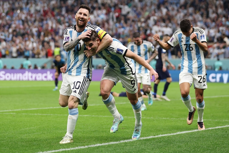 Julian Alvarez celebrates with Lionel Messi of Argentina after scoring the team's second goal during the FIFA World Cup Qatar 2022 semi final match between Argentina and Croatia at Lusail Stadium on December 13, 2022 in Lusail City, Qatar.