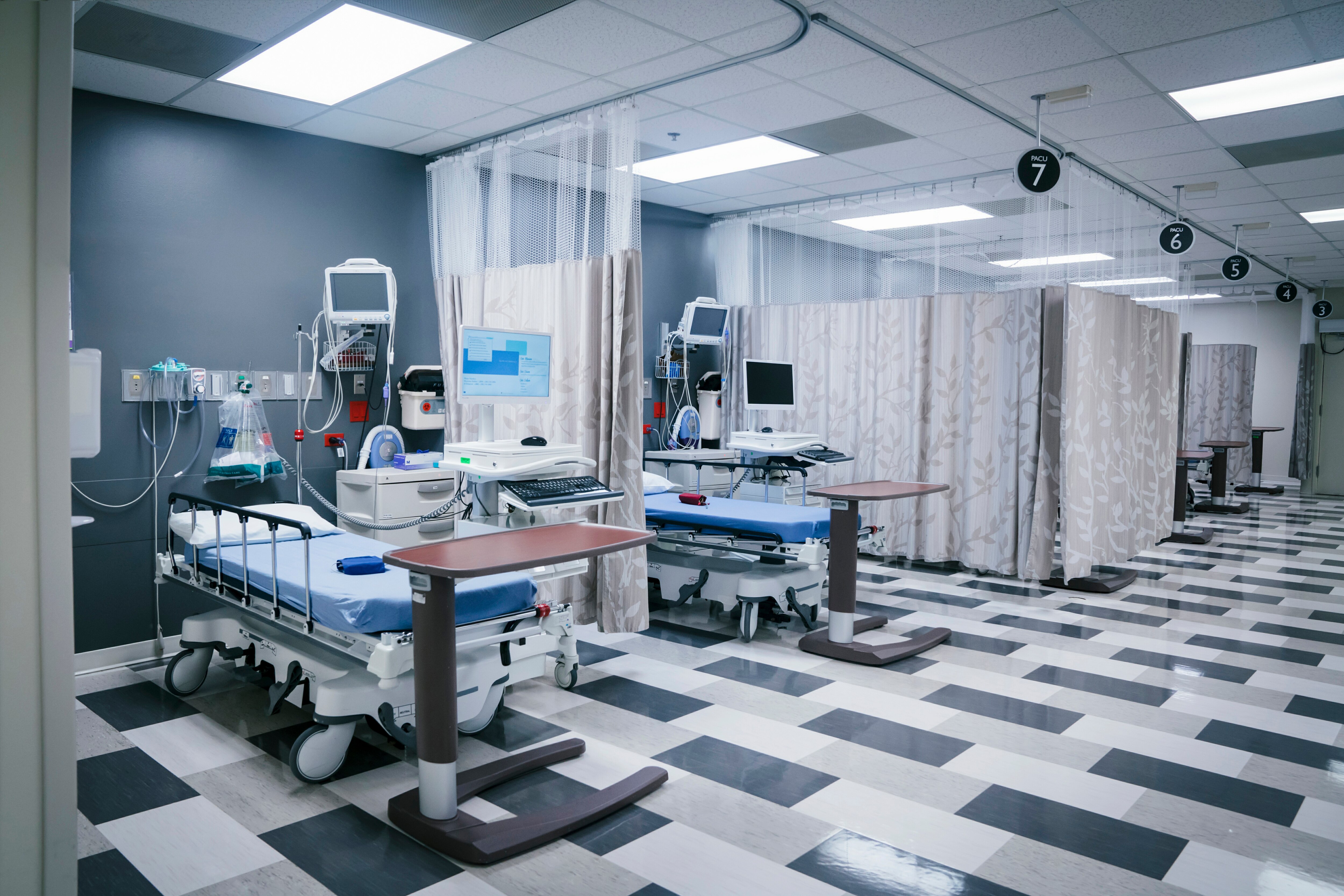 Hospital beds in an emergency room.