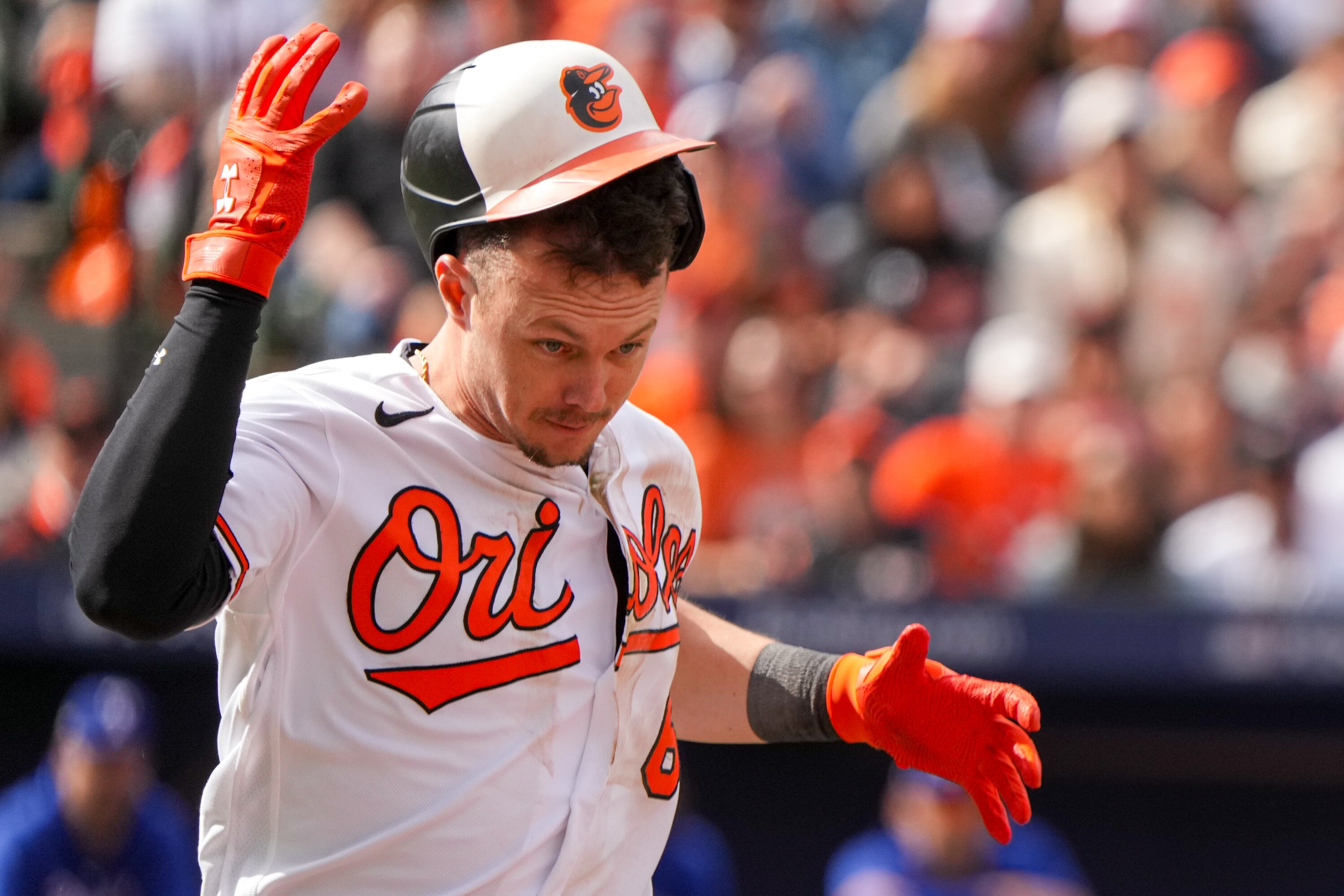Orioles first baseman Ryan Mountcastle’s helmet nearly falls off as he runs to first base.
