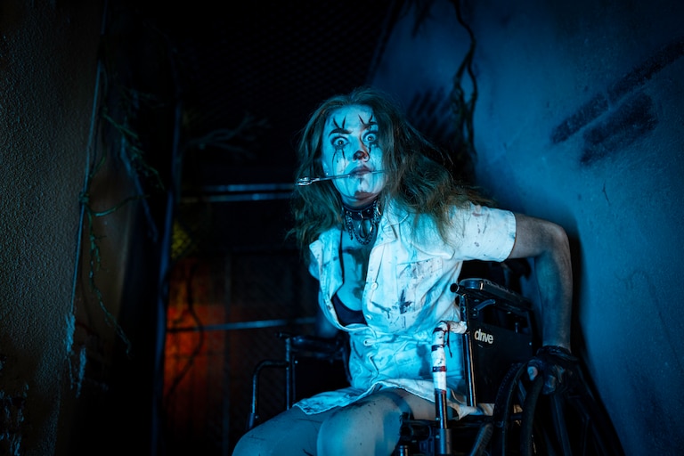 The Eastpoint Mall may have closed, but Bennett's Curse is reigning supreme for another season in the Dundalk shopping center. Come visit the haunted house's four featured frights, including Ravenbrook Asylum where orderlies, like the woman above, will show around the madhouse.