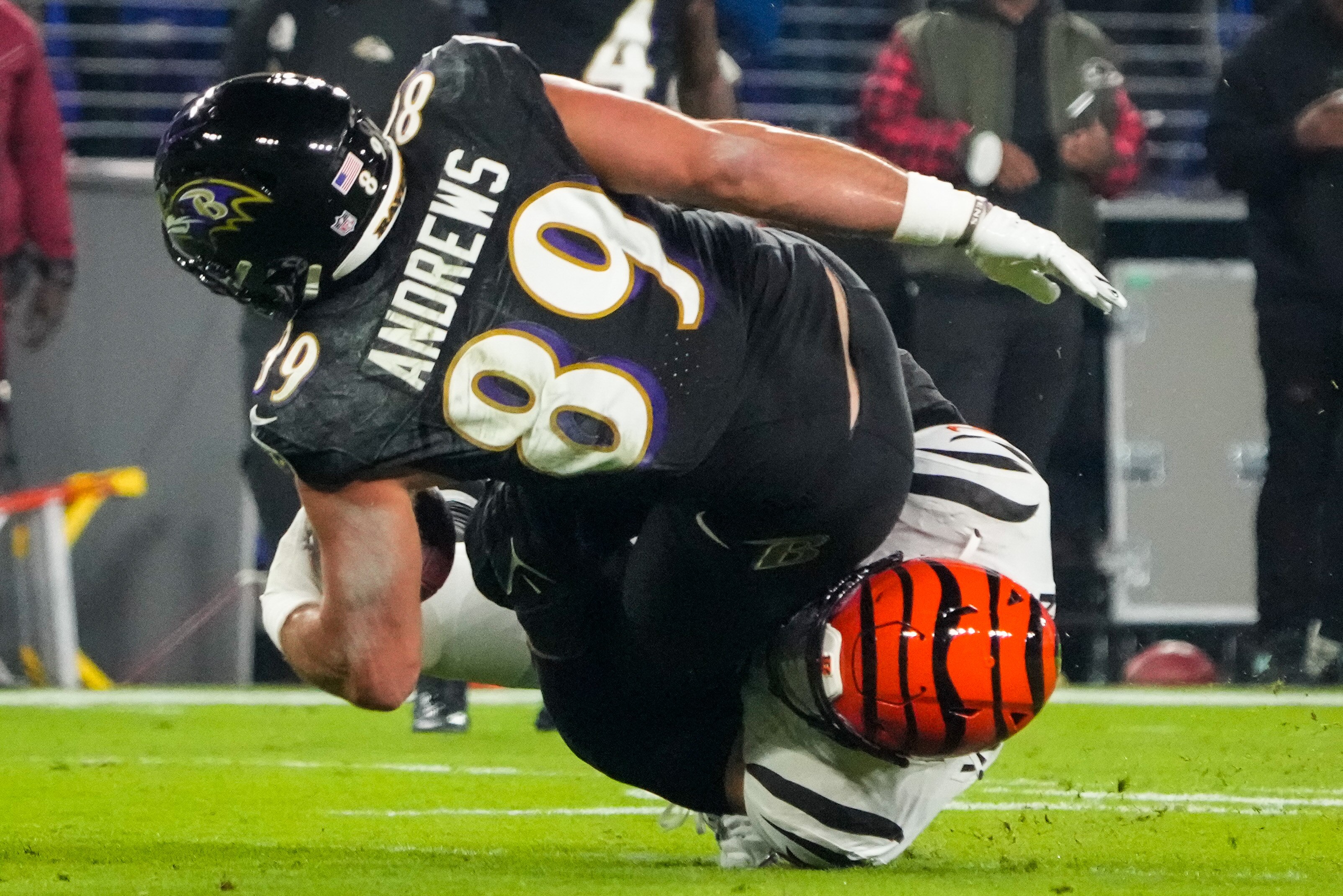 Baltimore Ravens tight end Mark Andrews (89) is tackled by Cincinnati Bengals linebacker Logan Wilson (55) during the first quarter at M&T Bank Stadium on Thursday, Nov. 16, 2023.
