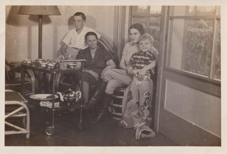 Eberhard, Friedel, Ruth, and Hans Keuhn at their Hawaii home in 1940 following Ruth’s day of riding horses on the family property. Handwritten note on the back of the pic