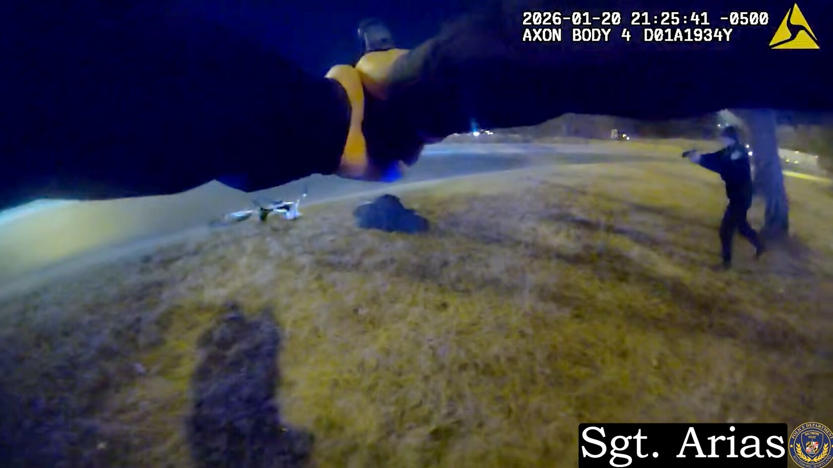 A still from a body camera worn by Baltimore Police Sgt. Carlos Arias shows two Baltimore Police Department officers and a 40-year-old man they shot and killed near 6500 Eastern Avenue on January 20, 2026.