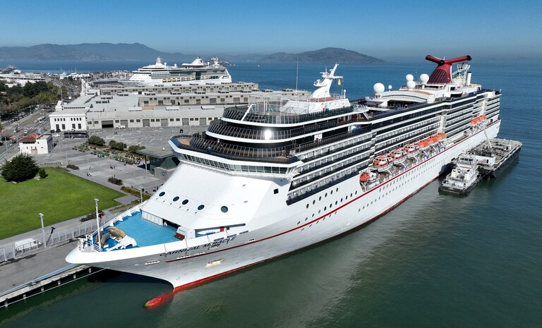 In an aerial view, the Carnival Miracle cruise ship operated by Carnival Cruise Lines sits docked at Pier 27 on September 30, 2022 in San Francisco, California.