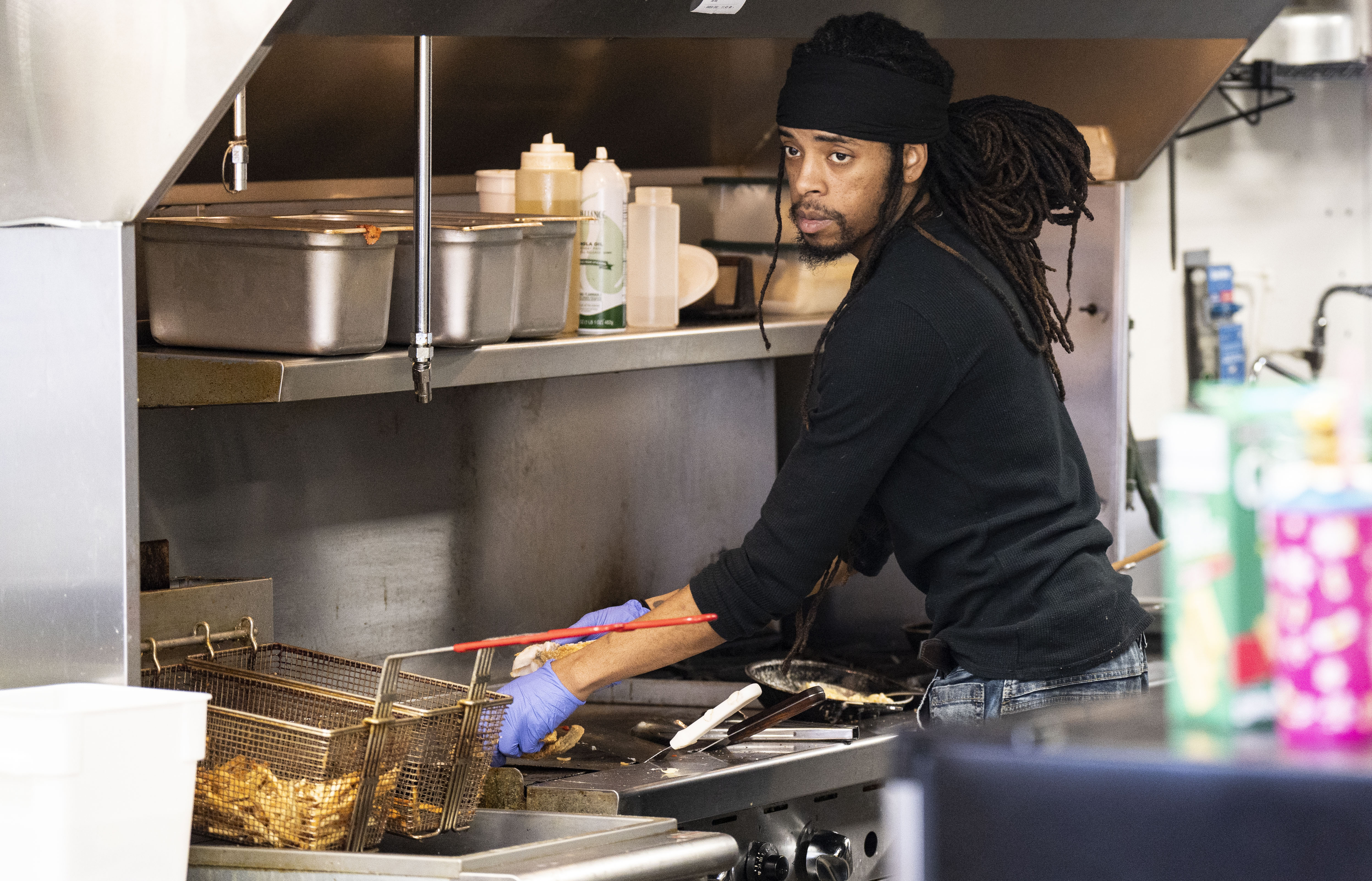Reggie Spence, chief at Charmed, prepares lunches at the restaurant, in Baltimore, Wednesday, February 1, 2023.