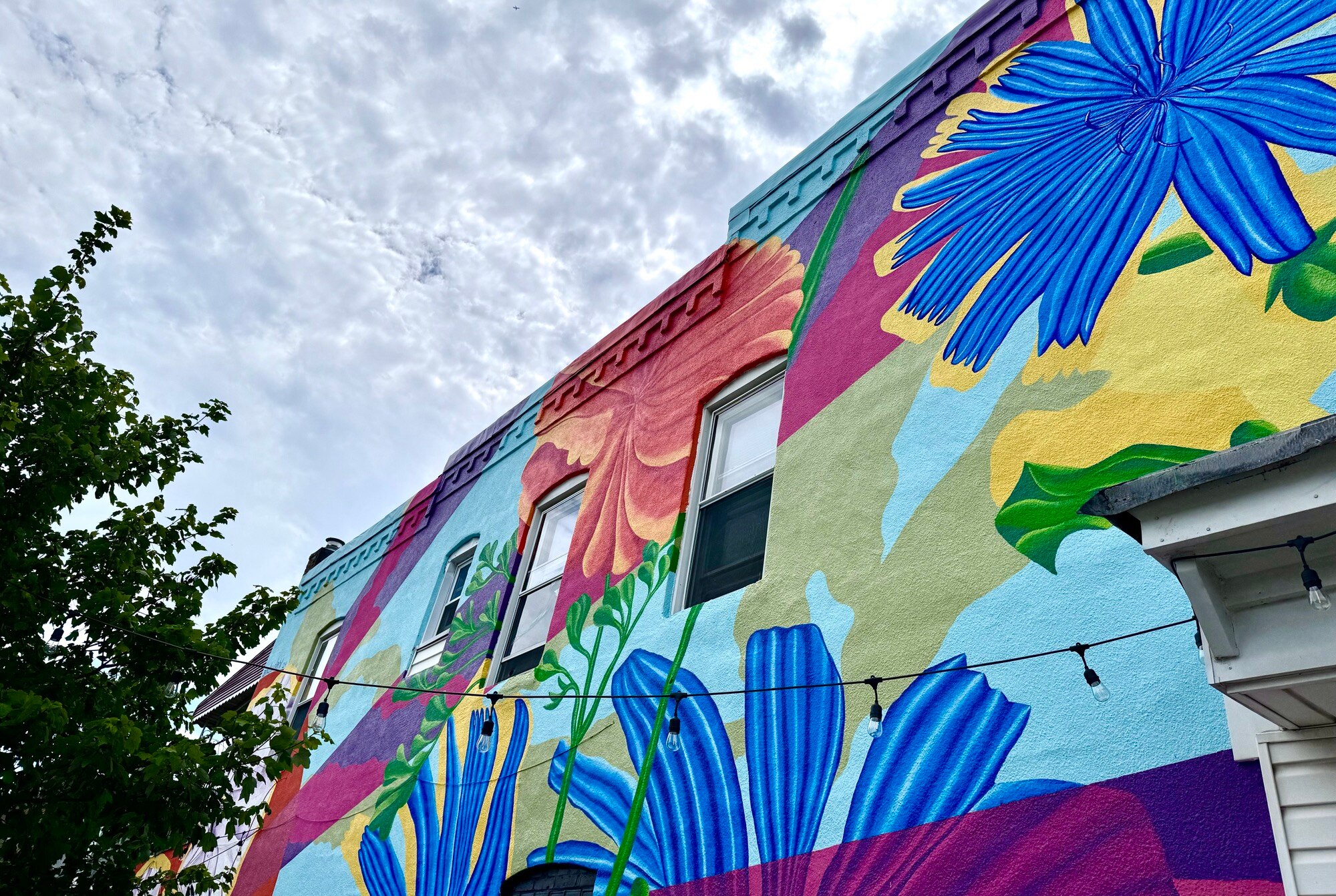 A mural by local artist Andy Dahl on the home of Charles Foster was shown to the public for the first time on July 18, 2024. The mural took Dahl about a month to finish.