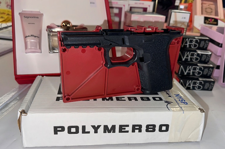 FILE - A ghost gun that police seized from an organized shoplifting crime ring is on display during a news conference at the Queens District Attorney's office in New York City, Nov. 26, 2024.