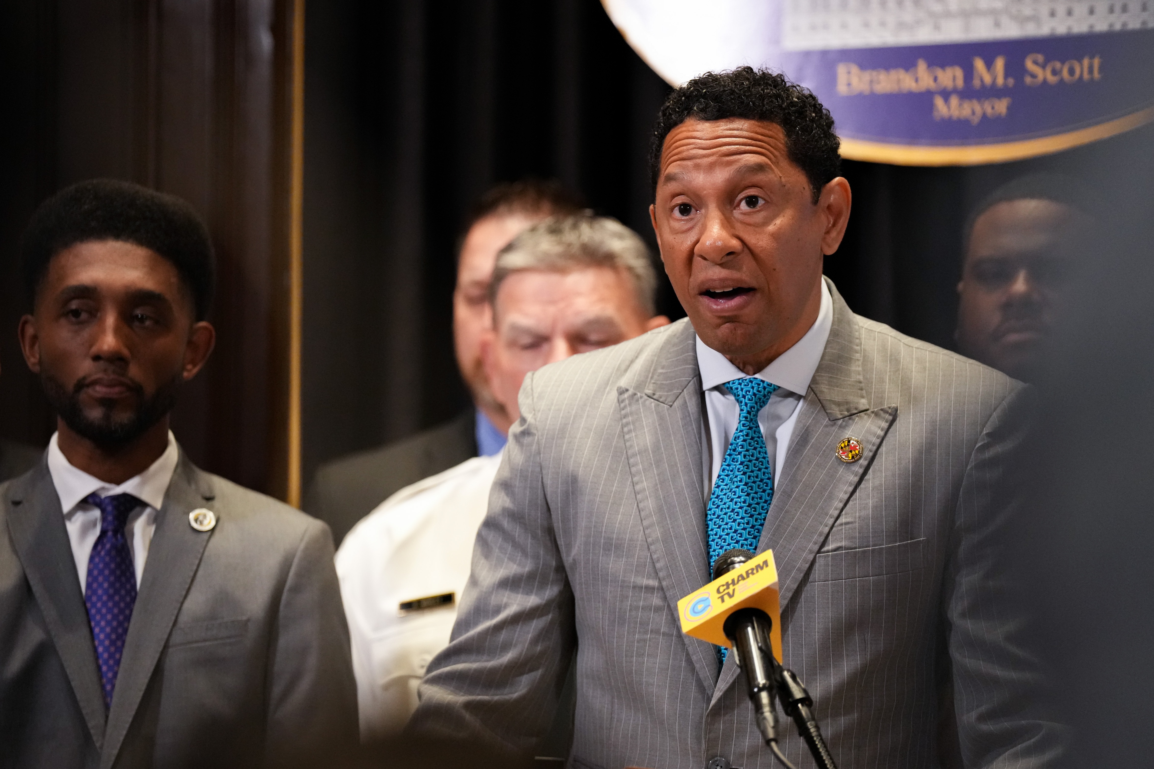 In this photo from June 23, 2023, Baltimore State’s Attorney Ivan Bates, flanked by Mayor Brandon Scott, speaks during a news conference at Baltimore City Hall.
