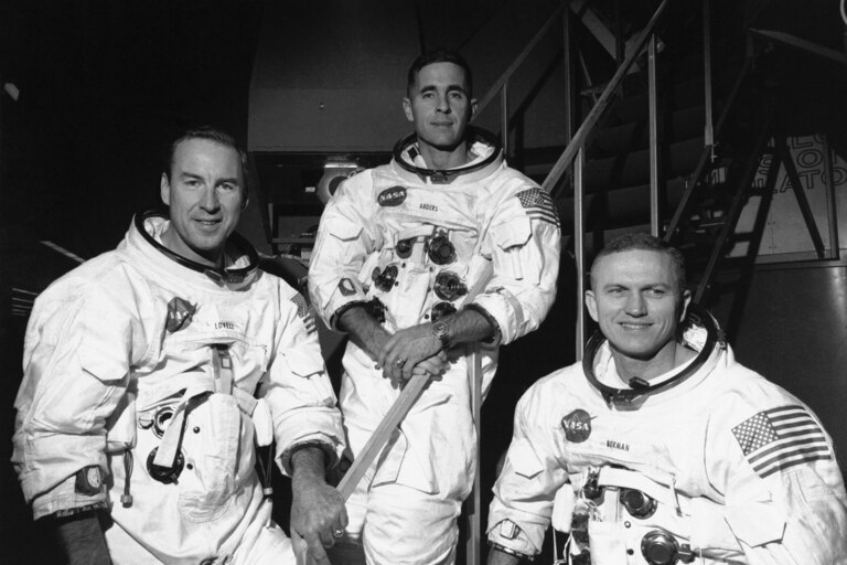 Apollo 8 astronauts, from left, James Lovell, command module pilot; William Anders, lunar module pilot; and Frank Borman, commander; stand in front of mission simulator prior to training in exercise for their scheduled six-day lunar orbital mission at the Kennedy Space Center in Florida, Dec. 18, 1968. Borman, who commanded Apollo 8's historic Christmas 1968 flight that circled the moon 10 times and paved the way for the lunar landing seven months later, has died. He was 95. Borman died Tuesday, Nov. 7, 2023, in Billings, Mont., according to a NASA statement Thursday, Nov. 9. (AP Photo/File)