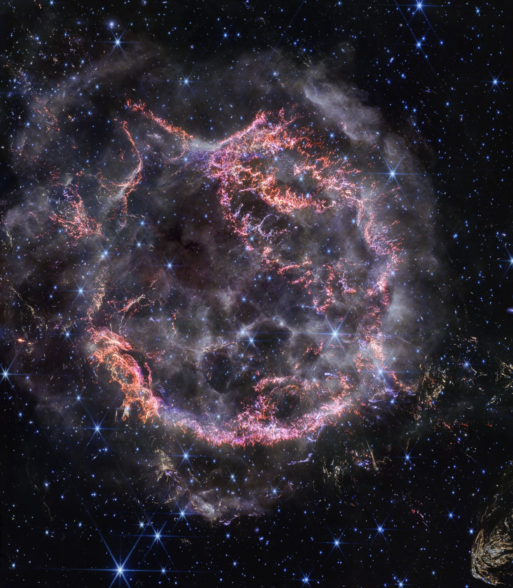 A new high-definition image from NASA’s James Webb Space Telescope’s Near-Infrared Camera unveils intricate details of supernova remnant Cassiopeia A, and shows the expanding shell of material slamming into the gas shed by the star before it exploded.