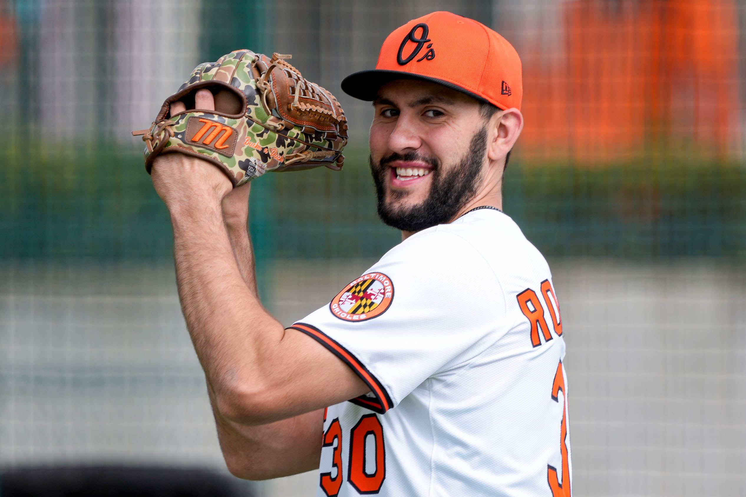Baltimore Orioles pitcher Grayson Rodriguez (30) prepares a pitch during Spring Training at Ed Smith Stadium in Sarasota, Fla. on Thursday, February 20, 2025.