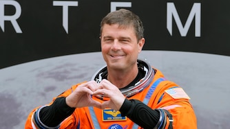 Mission Commander Reid Wiseman makes a heart with his hands as he leaves the Operations and Checkout Building for a trip to Launch Pad 39-B and a planned liftoff on NASA's Artermis II moon rocket at the Kennedy Space Center Wednesday, April 1, 2026, in Cape Canaveral, Fla. (AP Photo/Chris O'Meara)