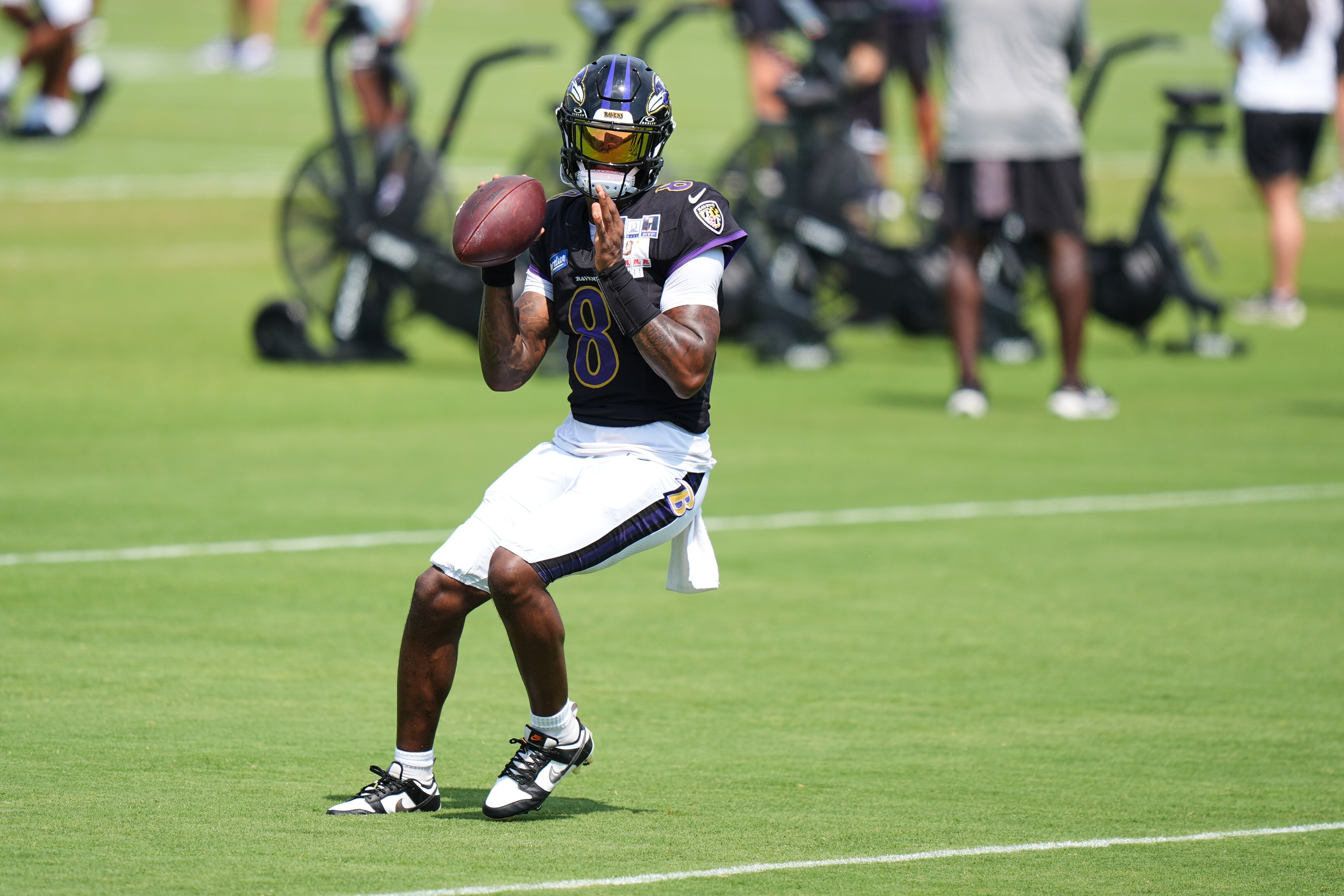 Ravens quarterback Lamar Jackson gets ready to throw the ball during the team's training camp practice on Aug. 11.