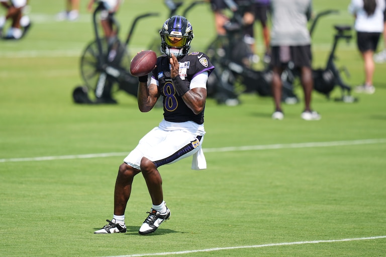 Ravens quarterback Lamar Jackson gets ready to throw the ball during the team's training camp practice on Aug. 11.