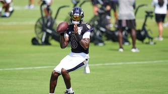 Ravens quarterback Lamar Jackson gets ready to throw the ball during the team's training camp practice on Aug. 11.