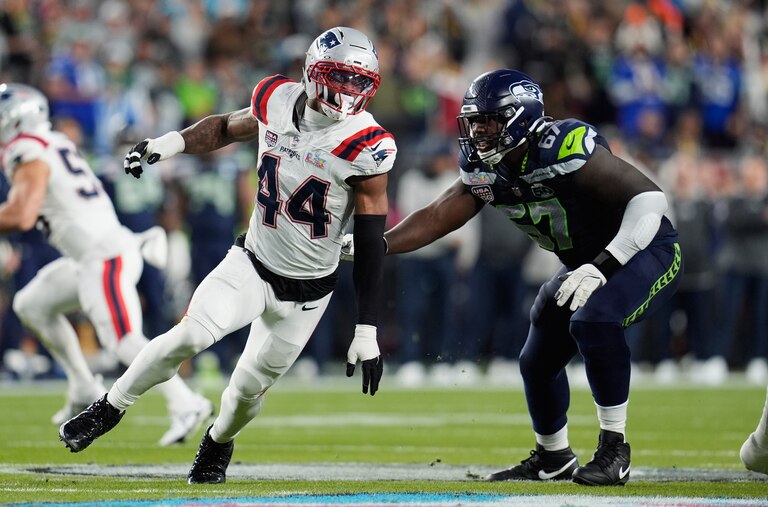 Former New England Patriots linebacker K'Lavon Chaisson (44) looks to get past Seattle Seahawks offensive tackle Charles Cross (67) during the Super Bowl 60.