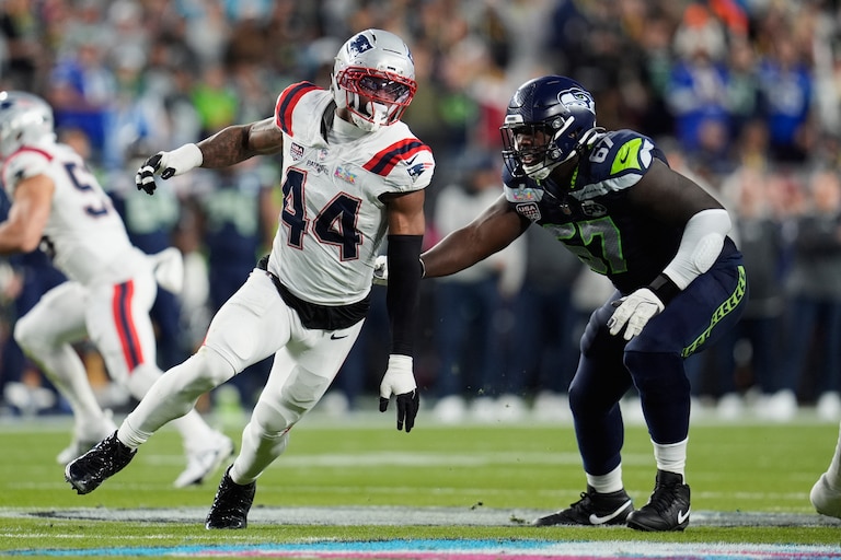 Former New England Patriots linebacker K'Lavon Chaisson (44) looks to get past Seattle Seahawks offensive tackle Charles Cross (67) during the Super Bowl 60.