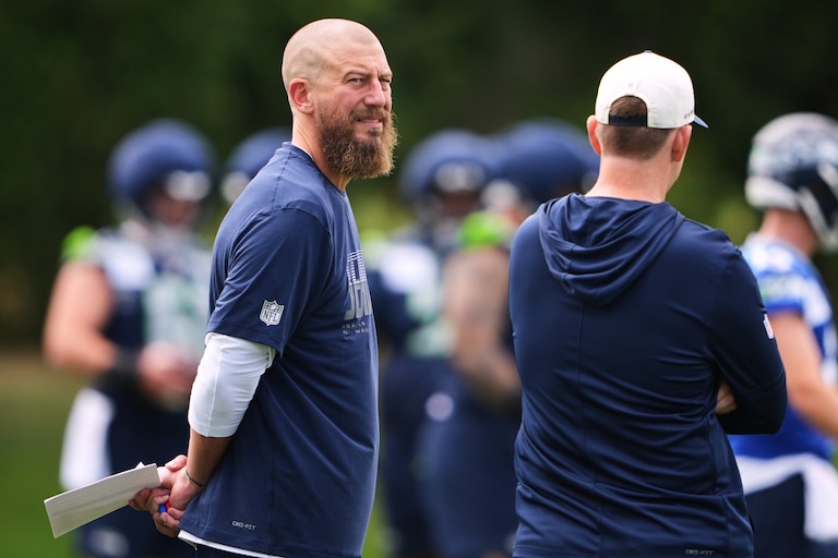 Seattle Seahawks offensive coordinator Brian Fleury on the field during training camp.