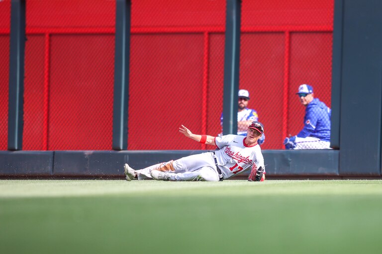 ATLANTA, GA - JUNE 10: Alex Call #17 of the Washington Nationals makes a diving catch against the Atlanta Braves in the sixth inning at Truist Park on June 10, 2023 in Atlanta, Georgia.
