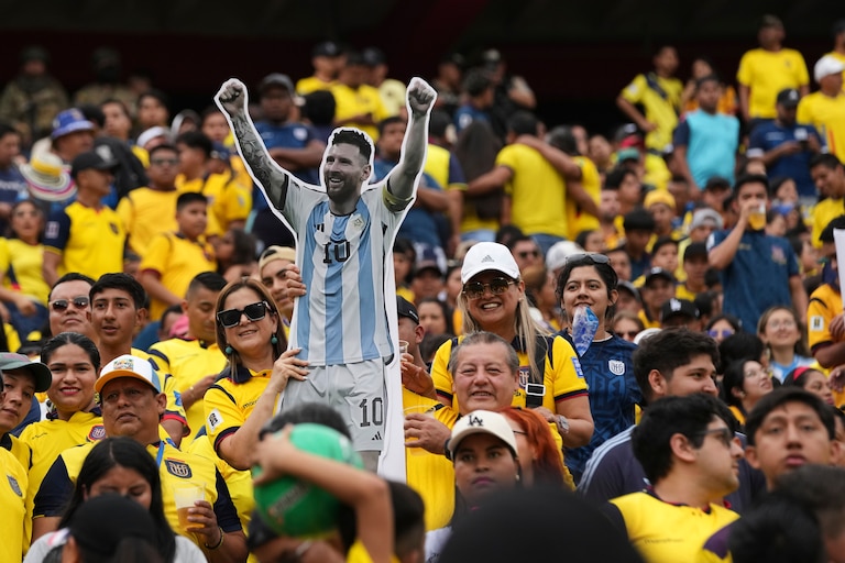 A soccer fan holds a cardboard cutout of Argentina's Lionel Messi prior to a World Cup 2026 qualifying soccer match against Ecuador at Banco Pichincha stadium in Guayaquil, Ecuador, Tuesday, Sept. 9, 2025.