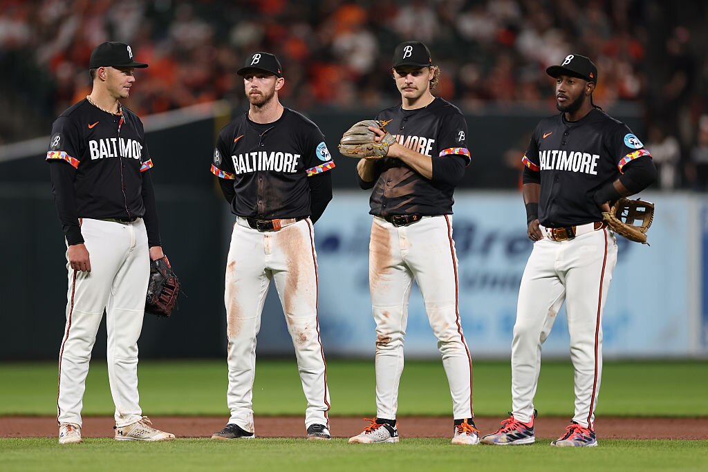 BALTIMORE, MARYLAND - APRIL 18: (L-R) Ryan Mountcastle #6, Jordan Westburg #11, Gunnar Henderson #2 and Jorge Mateo #3 of the Baltimore Orioles look on against the Cincinnati Reds at Oriole Park at Camden Yards on April 18, 2025 in Baltimore, Maryland.