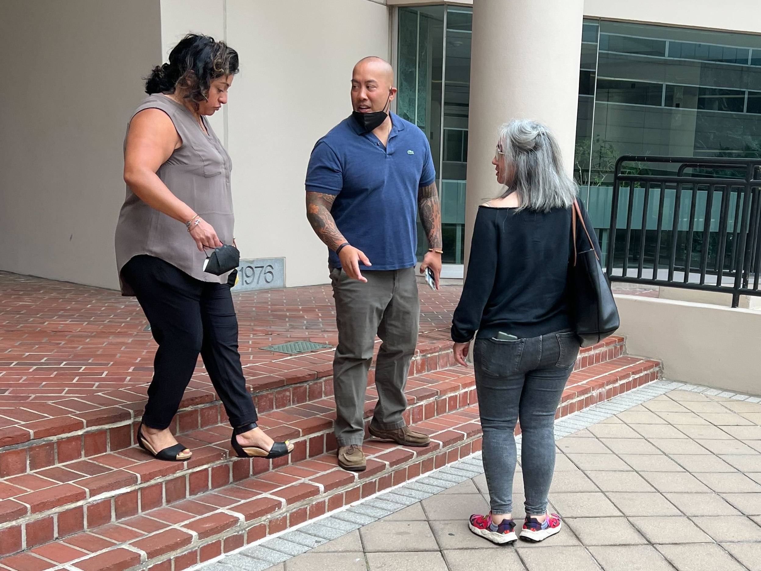 Robert Hankard, center, leaves the downtown Baltimore federal courthouse July 28 after being sentenced to 30 months in prison.