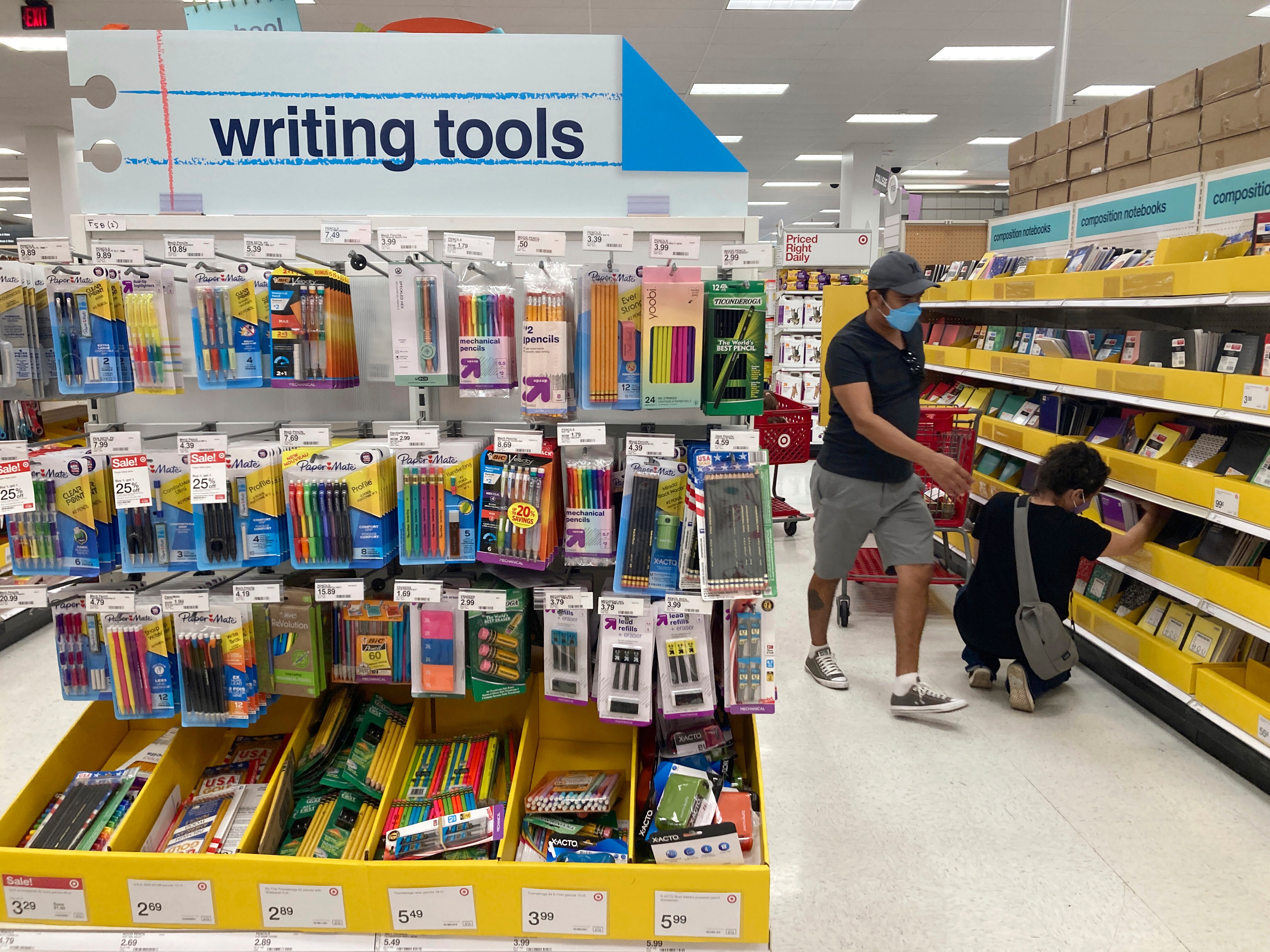 FILE - Shoppers look for school supplies deals at a Target store, July 27, 2022, in South Miami, Fla.