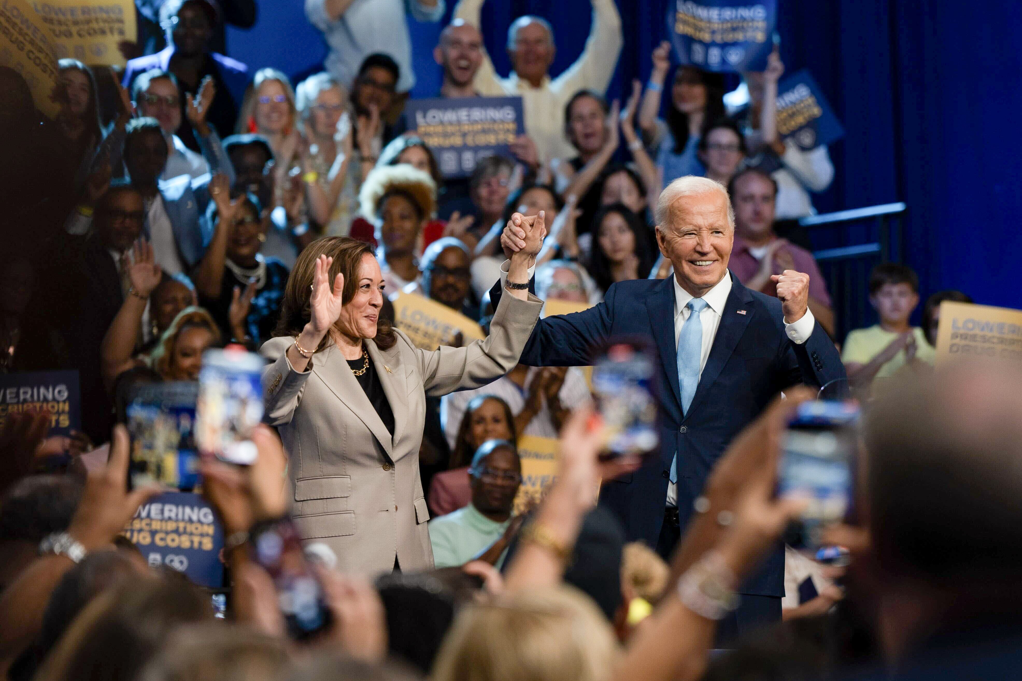 President Joe Biden and Vice President Kamala Harris cheer before delivering remarks on prescription drug prices at Prince George's Community College on Thursday. It was their first joint appearance since Biden ended his presidential re-election campaign and endorsed Harris.