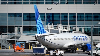 FILE - A United Airlines jetliner sits at a gate along the A concourse of Denver International Airport, March 20, 2026, in Denver. (AP Photo/David Zalubowski, File)