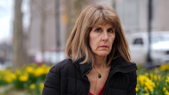 Isabel Mercedes Cumming, Baltimore City's Inspector General, sits for a portrait in War Memorial Plaza on Monday, March 13.