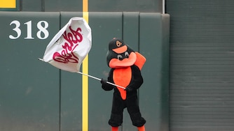 The Oriole Bird waves the Berks Flag following a Hot Dog Race in a game between the Baltimore Orioles and the Chicago White Sox at Oriole Park at Camden Yards in Baltimore, Md. on Friday, May 30, 2025.