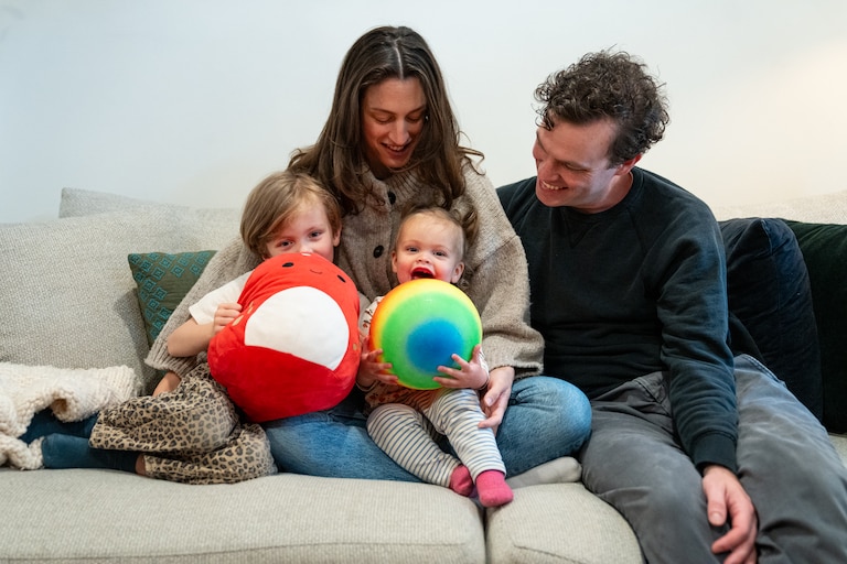 SUNDAY, MAY 24, 2026 - Molly Garcia, 34, husband Neil Gavigan, 36, and their children August Garcia-Gavigan, 4, and Lucy Garcia-Gavigan, 15 months, at their home in Baltimore. August wasn’t offered a spot in a Baltimore City Public School earlier this month, leaving the family to decide whether to wait as late as this summer for another chance or shell out $22,000 for another year of childcare.