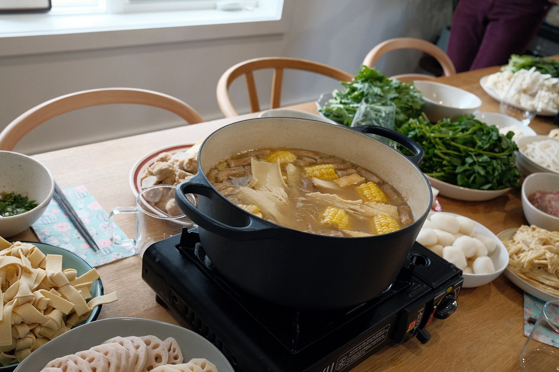 The Chang family, which operates a regional restaurant empire including Q by Peter Chang in Bethesda, prefers to have a Chinese-style hot pot for Thanksgiving. The spread, seen here at their Virginia home, typically includes beef tenderloin, blue crab, bean curd and more.