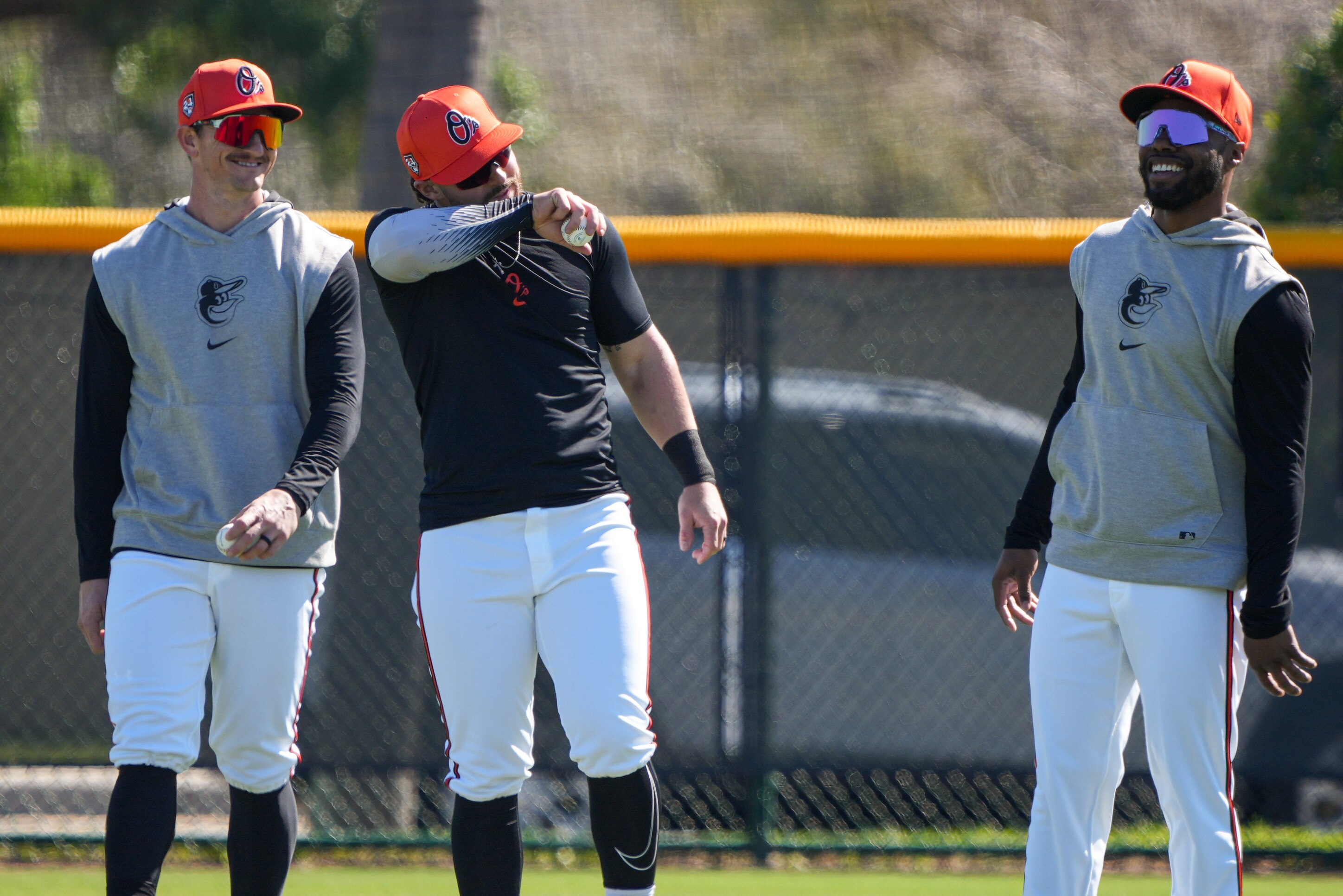 Orioles outfielders Austin Hays, Ryan McKenna and Cedric Mullins laugh together during spring training in Sarasota, Florida.