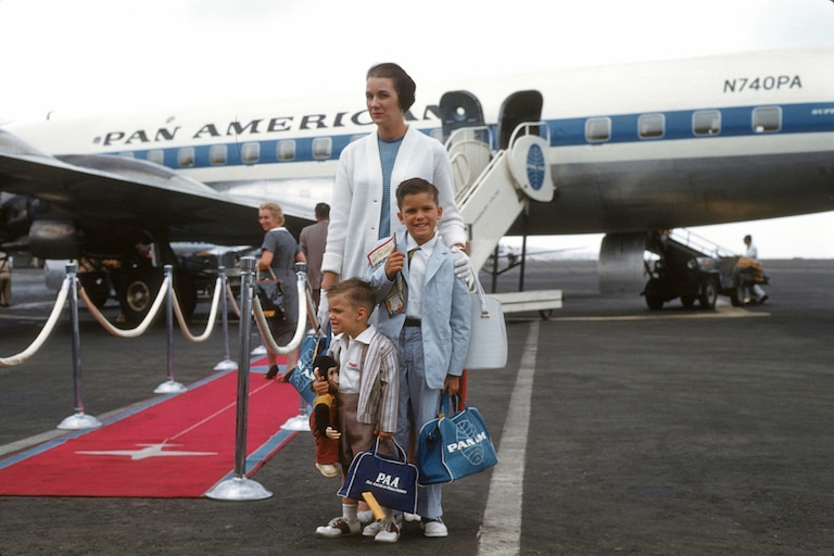 Jeff Wright, left, his brother William, and mother Mabel boarding a PanAM flight in the late 1950s.