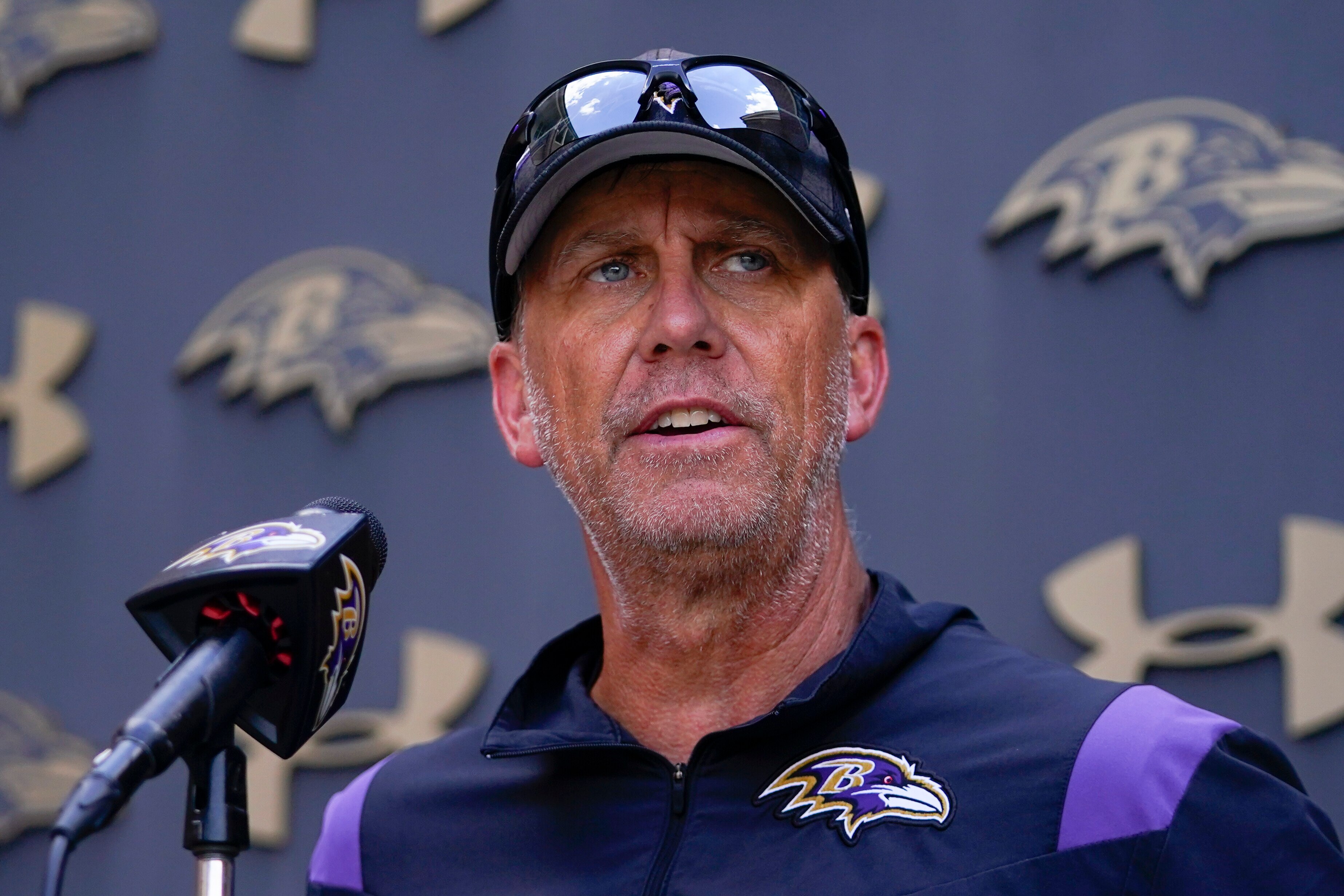 Baltimore Ravens offensive coordinator Todd Monken talks to reporters during his team's NFL football training camp, Thursday, Aug. 17, 2023, in Owings Mills, Md.