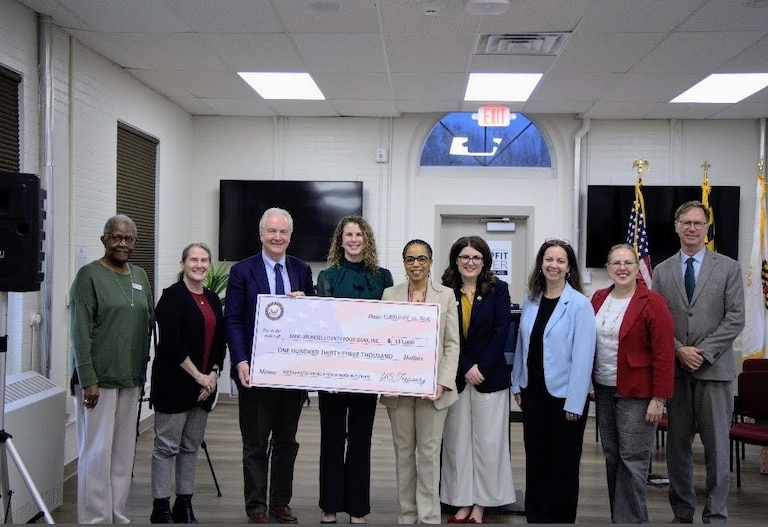 Big fake checks are a regular illustration of federal spending in local communities. In February, U.S. Sens. Chris Van Hollen and Angela Alsobrooks held up one for $133,000 with Anne Arundel County Food Bank Executive Director Leah Paley.