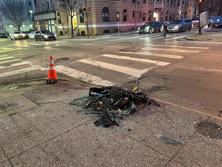 Vehicle debris, shattered glass and a leaning pole remained hours after a collision involving two cars and an MTA bus in Midtown-Belvedere early Thursday, March 19, 2025.