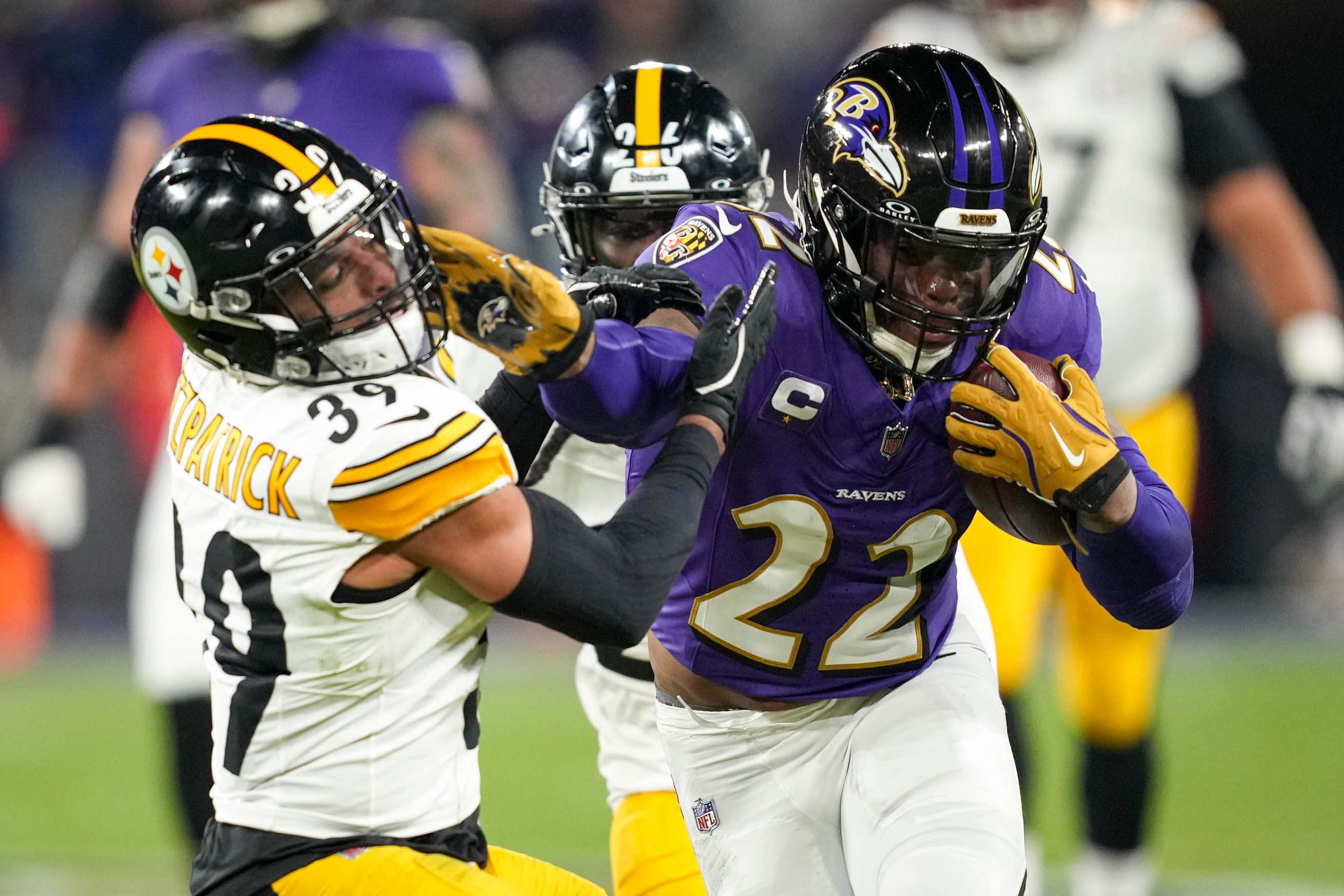 Derrick Henry pushes away Steelers safety Minkah Fitzpatrick on his way to 186 yards rushing Saturday night.
