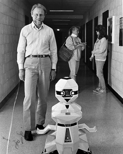 Robert Lewand with a simple robot he purchased, called Topo, as an educational tool for introductory computer programming while at Goucher College in the 1980s.