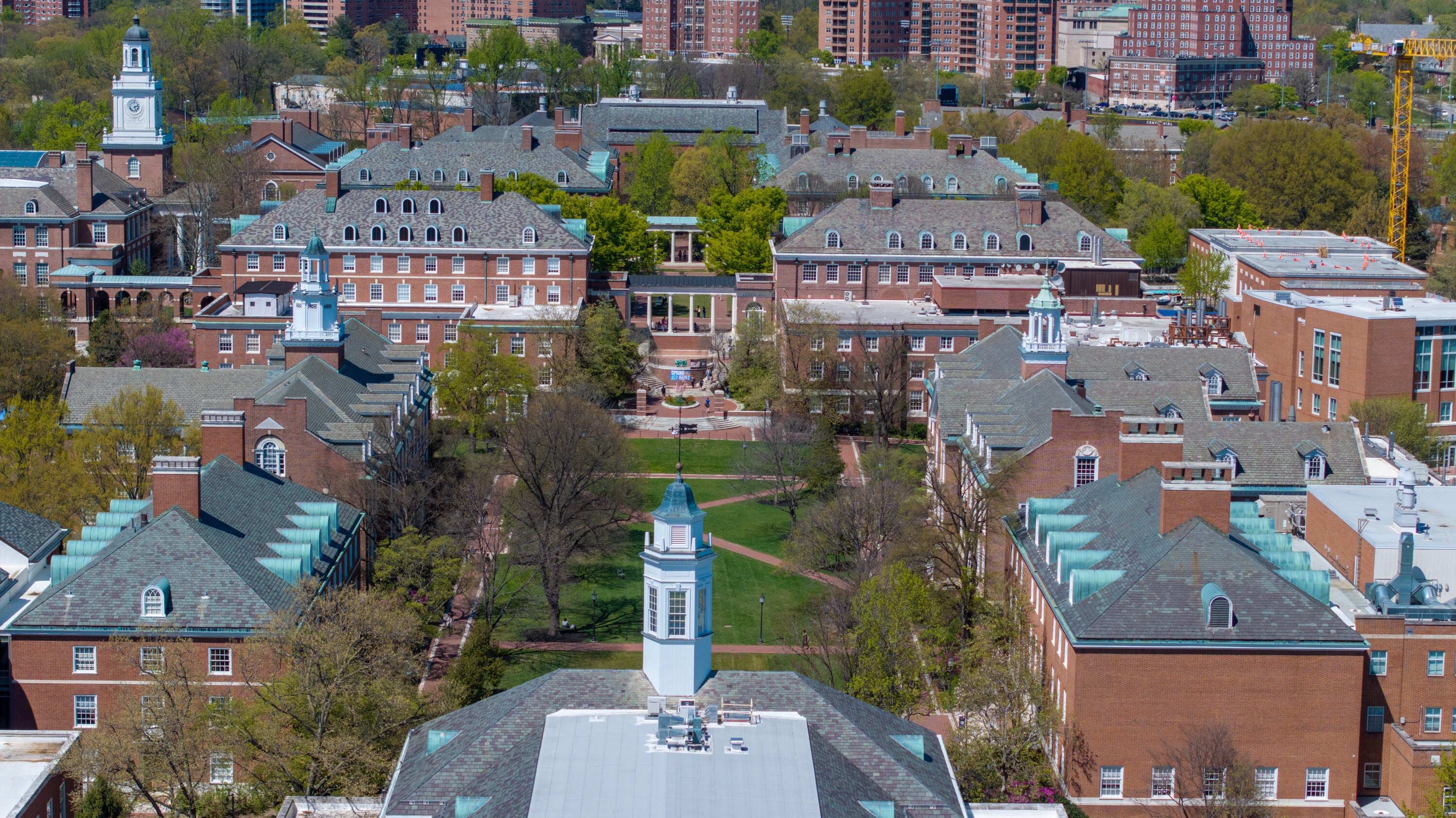 Johns Hopkins University will freeze staff hiring and pay increases as it deals with federal funding losses.