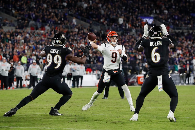 BALTIMORE, MARYLAND - OCTOBER 09: Joe Burrow #9 of the Cincinnati Bengals passes against Odafe Oweh #99 and Patrick Queen #6 of the Baltimore Ravens at M&T Bank Stadium on October 09, 2022 in Baltimore, Maryland.
