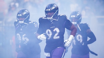 Baltimore Ravens defensive tackle Nnamdi Madubuike (92) runs out of the tunnel with his teammates before a game against the Philadelphia Eagles at M&T Bank Stadium in Baltimore, Md. on Sunday, December 1, 2024.